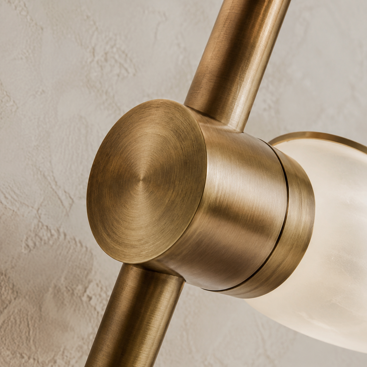 Brushed brass lighting joint with a precise hand-finished surface