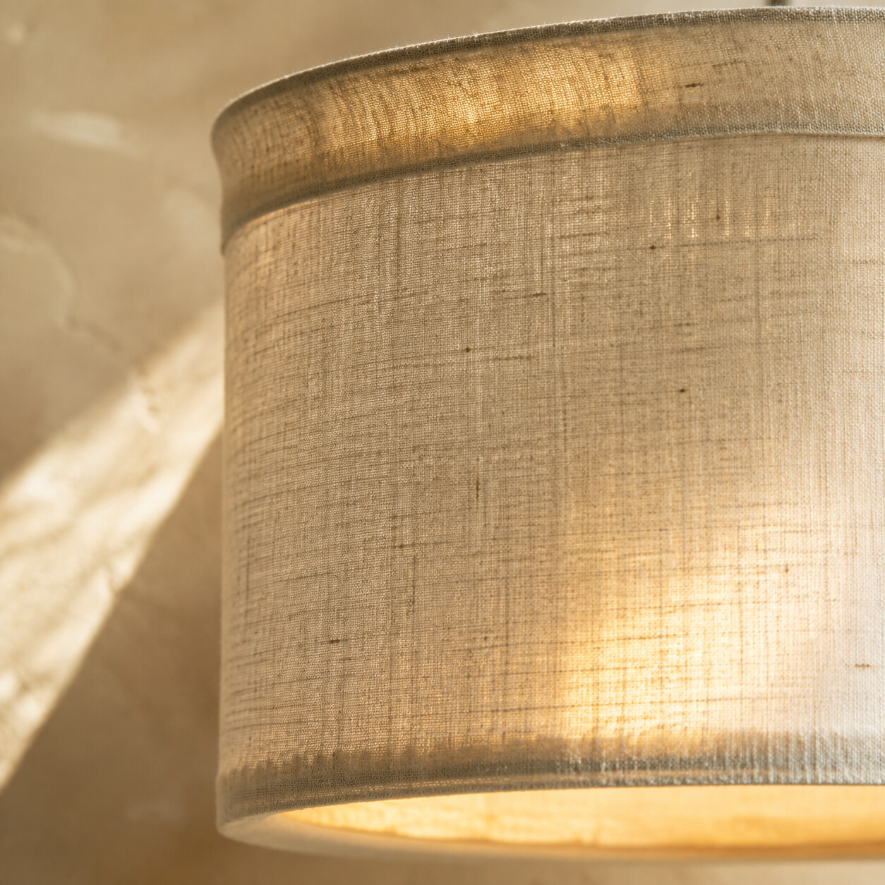 Fine woven linen lampshade with a softened warm glow
