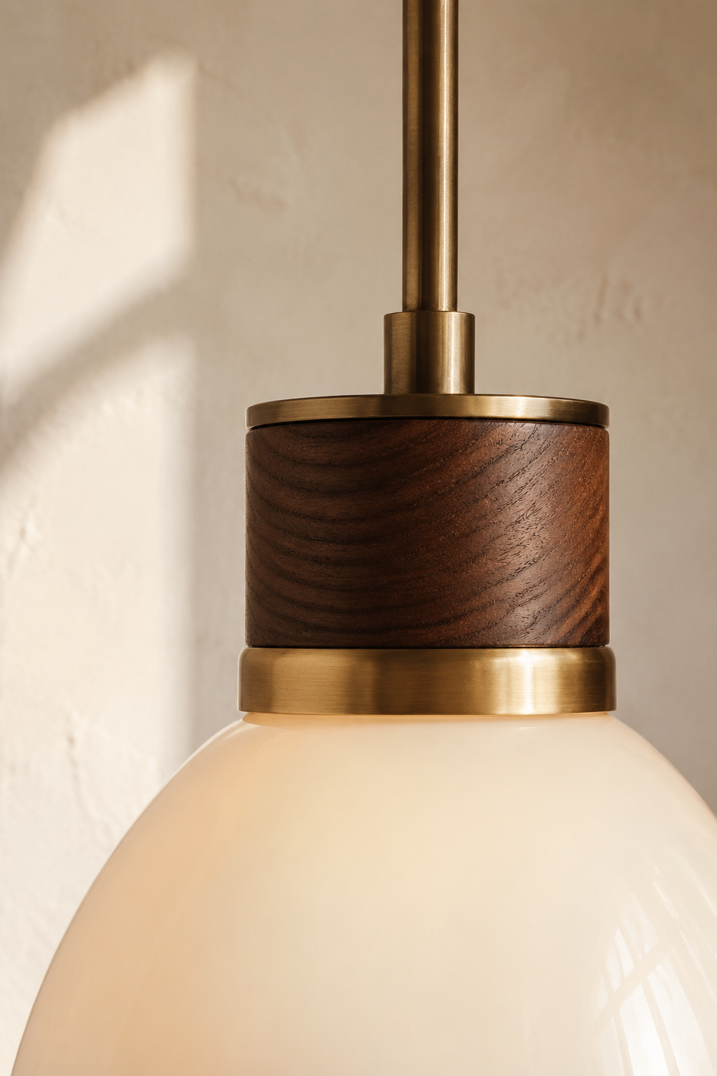 Handcrafted walnut, brass and opal glass lighting detail