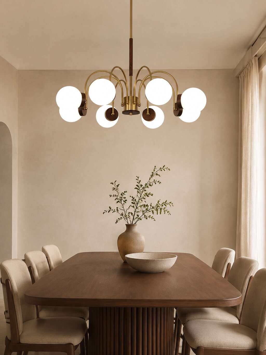 A sculptural chandelier above a warm dining table.