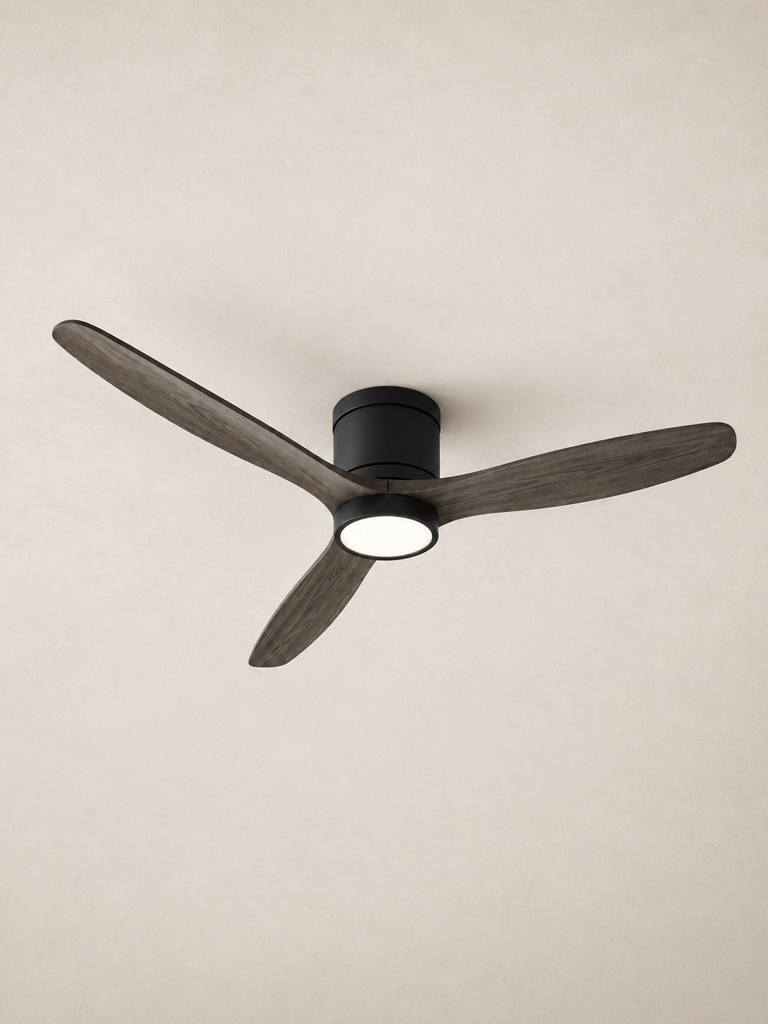 Gray flush mount ceiling fan centered on pale ivory