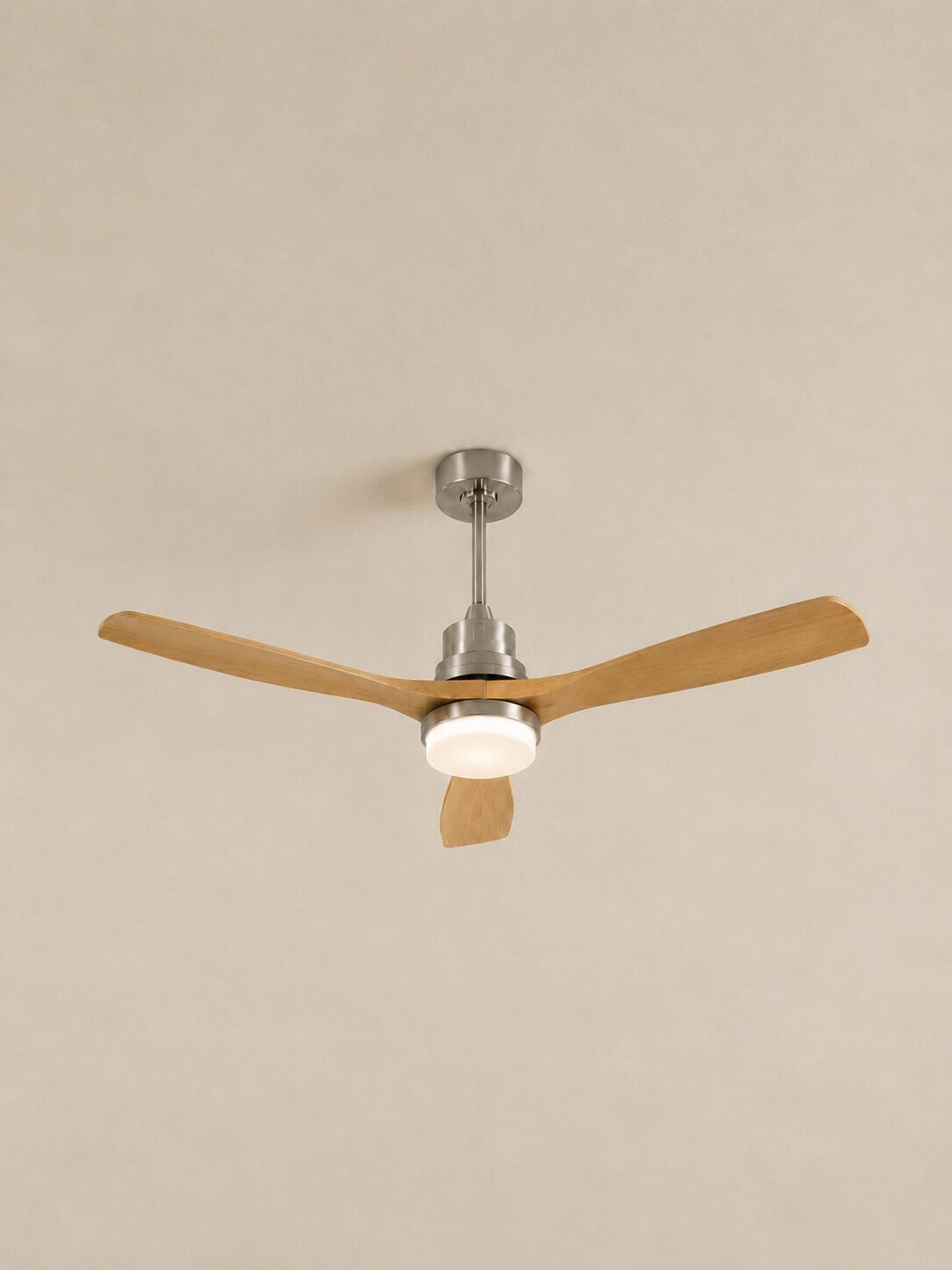 52-inch Wooden Color three-blade ceiling fan with integrated LED centered on a pale limewash ceiling